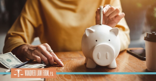 putting money in piggy bank